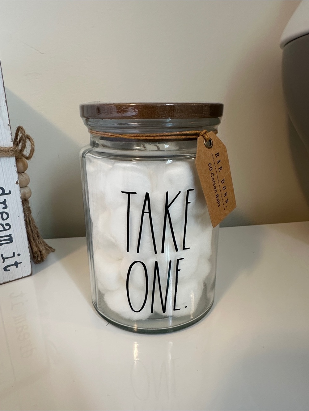 Rae Dunn Clear Glass 'TAKE ONE' Jar with Brown Lid - Cotton Balls